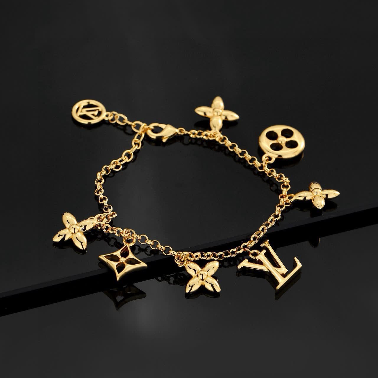 Louis Vuitton Gold Tone Bracelet with Charms